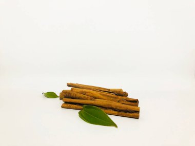 Fragrant cinnamon sticks on a white background