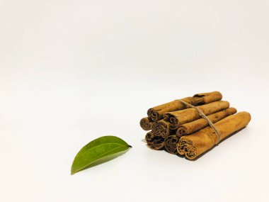 Fragrant cinnamon sticks on a white background