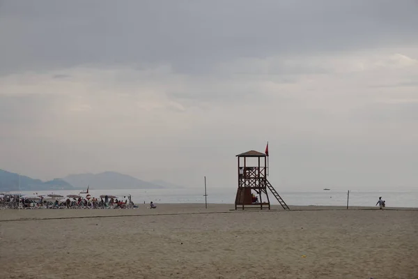 Lifeguard tower on a deserted beach against the background of the sea, minimalism, evening, Alanya, Turkey, October 2021.