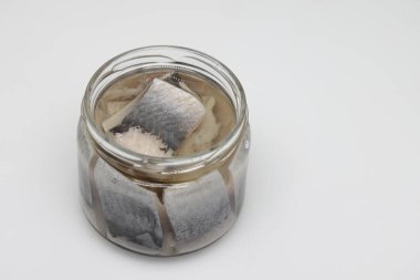 Puddle of condensed milk flows from levitating jar, can opener, black bread.