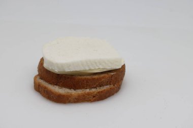 Butter and goat cheese sandwich, dietary product.