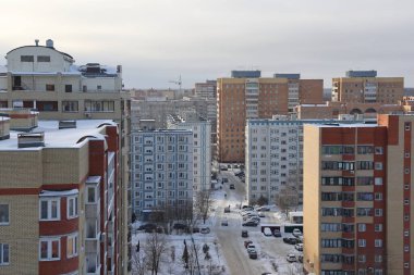 Moscow region. January 12, 2022. Modern residential area on a frosty winter morning. Residential buildings. Snowy street