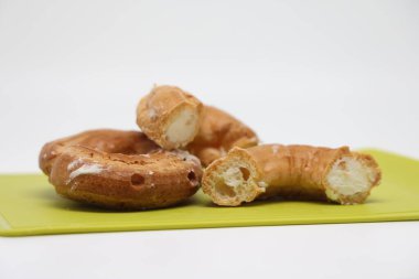 Transparent glass tumbler with water on a purple background. Copy space