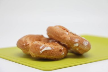 Transparent glass tumbler with water on a purple background. Copy space
