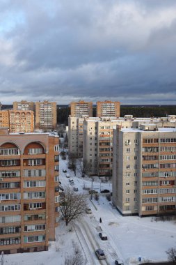 Moscow region. January 12, 2022. Modern residential area on a frosty winter morning. Residential buildings. Snowy street