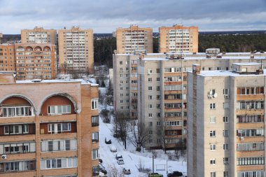 Moscow region. January 12, 2022. Modern residential area on a frosty winter morning. Residential buildings. Snowy street