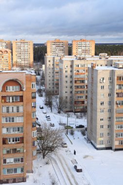 Moscow region. January 12, 2022. Modern residential area on a frosty winter morning. Residential buildings. Snowy street