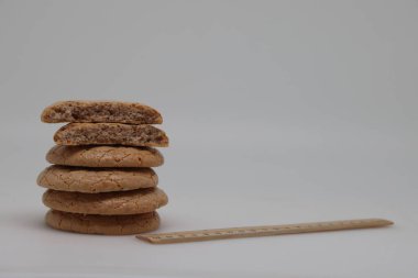 Nut cookies on electronic kitchen scales, accurate calorie counting, proper nutrition