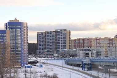 New snow covered high rise residential buildings in a Russian city. Moscow region, January 2022