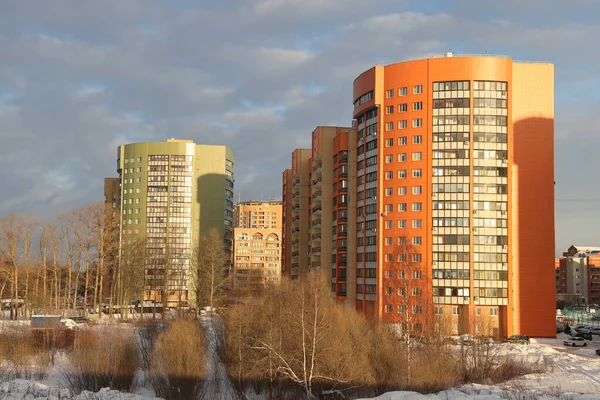 New snow covered high rise residential buildings in a Russian city. Moscow region, January 2022
