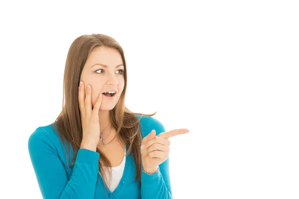 Shocked young woman points a finger — Stock Photo, Image