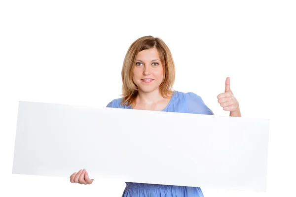 Portrait of a cheerful young brunette woman holding a white blan — Stock Photo, Image