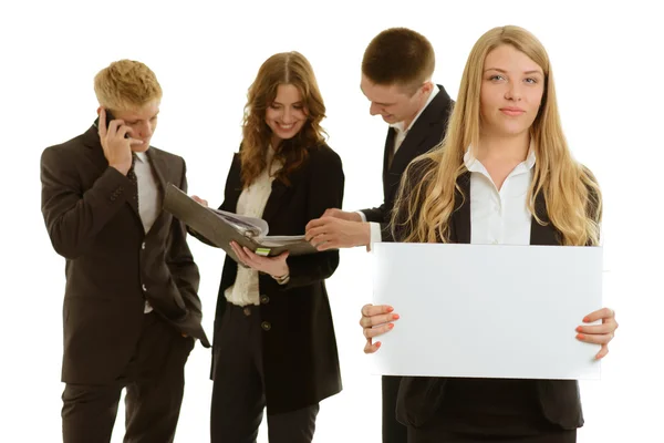 Group of business people holding a banner ad isolated on white — Stock Photo, Image