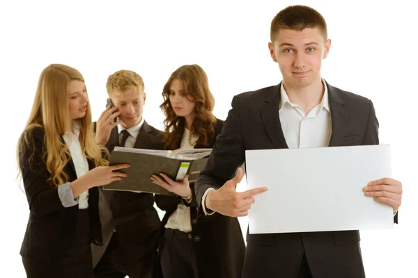 Group of business people holding a banner ad isolated on white — Stock Photo, Image