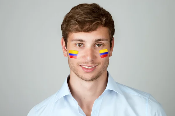 Красивий зображений юнаком iз прапор Колумбії живопису в обличчя — стокове фото