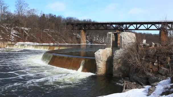 Railway Bridge over river with dam below — Stock Video