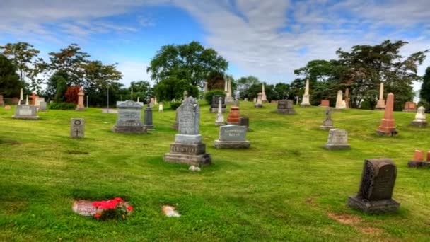 Timelapse view in a cemetary with blue skies — Stock Video