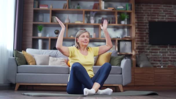 Peaceful Senior Retired Woman Practicing Yoga Home Mat Sitting Lotus — Videoclip de stoc