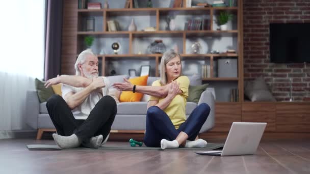 Active Mature Senior Couple Performing Stretching Exercise Practicing Yoga Home — Video