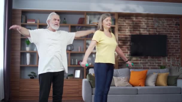 Active Mature Senior Couple Performing Stretching Exercise Practicing Yoga Home — Video