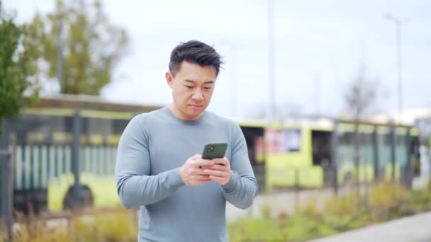 Asian Man Using Phone Bus Tram Stop Asian People Use — Stok video