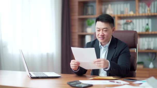 Excited Satisfied Asian Businessman Suit Reads Document Happy Man Looking — Vídeo de Stock