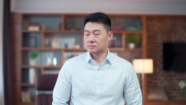 Close Portrait Serious Confident Asian Guy Employee Entrepreneur Office Worker — стоковое видео