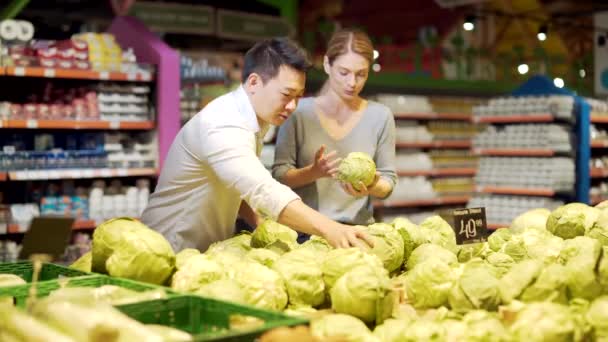 Happy Mixed Race Asian Couple Family Man Woman Choosing Vegetables — Stock Video