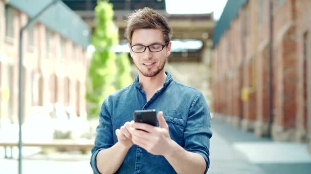 Handsome Young Man Uses Smartphone Stands Street Happy Cheerful Guy — Αρχείο Βίντεο