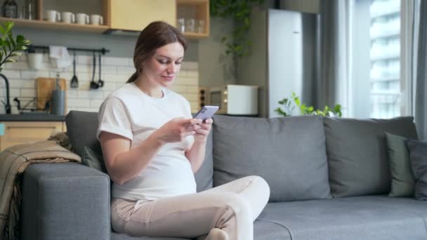Pregnant Caucasian Young Woman Using Mobile Phone Smartphone Home Happy – Stock-video