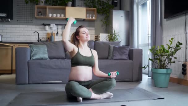 Pregnant Beautiful Woman Goes Sports Home Sits Dumbbells Yoga Mat — Stock Video