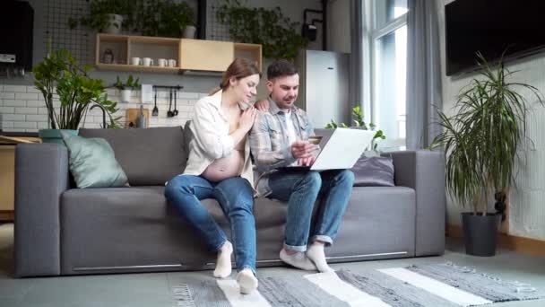 Expectant Married Couple Pregnant Wife Husband Shopping Online Paying Bills — Stock Video