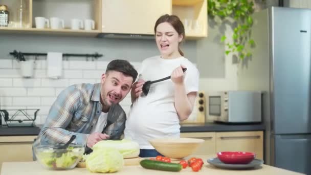Cheerful Happy Family Couple Expecting Baby Spend Funny Time Together — Stockvideo