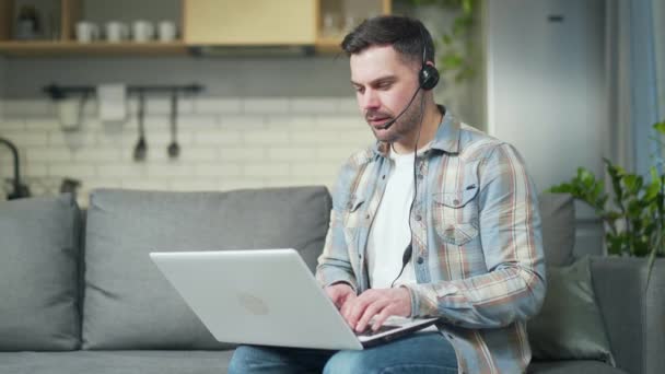 Young Handsome Bearded Caucasian Man Working Remotely Home Using Laptop — 图库视频影像
