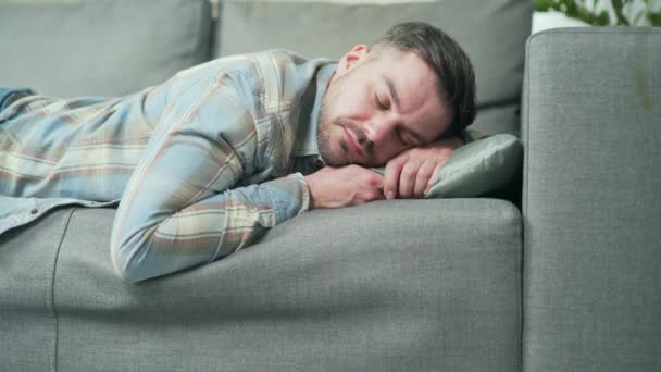 Tired Hard Day Young Caucasian Handsome Man Lying Sofa Resting — стокове відео