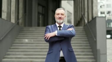 portrait happy mature gray haired bearded businessman. Looking at camera on urban background business office center outside outdoor Proud successful man Boss employee entrepreneur in formal suit smile