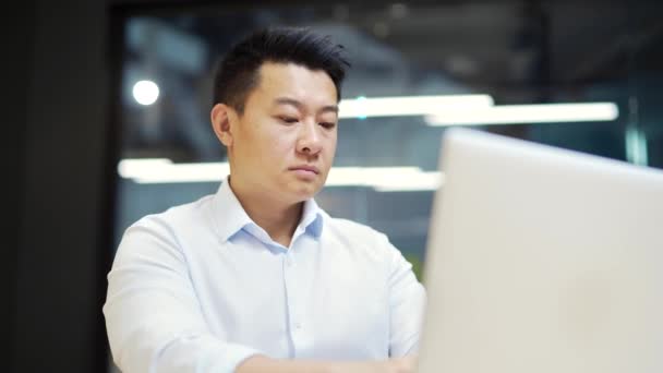 Portrait Thoughtful Asian Male Businessman Working Laptop Computer Modern Office — Video