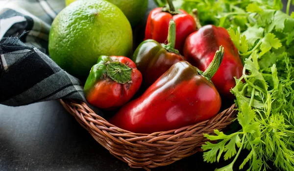 Some Fresh Red Chili Pepper Lemons Basket Fresh Coriander Black — Stockfoto