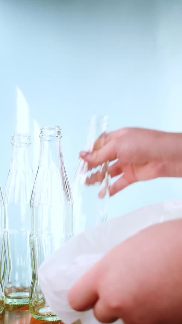 Caucasian Hand Leaving Some Glass Bottles Recycling White Bag Bright — Stockvideo