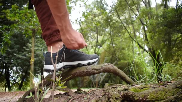 Man Tying His Trekking Shoes Branch Middle Forest Continue Walking — 图库视频影像