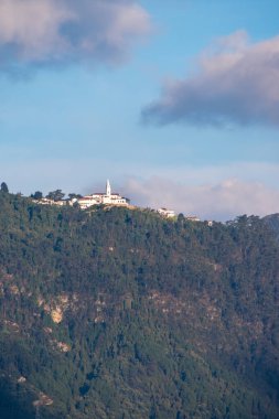 Landscape of high buildings with huge mountains at background in Bogota, Colombia