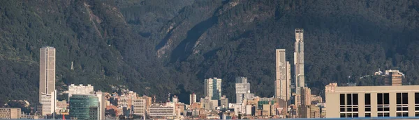 Landscape of high buildings with huge mountains at background in Bogota, Colombia