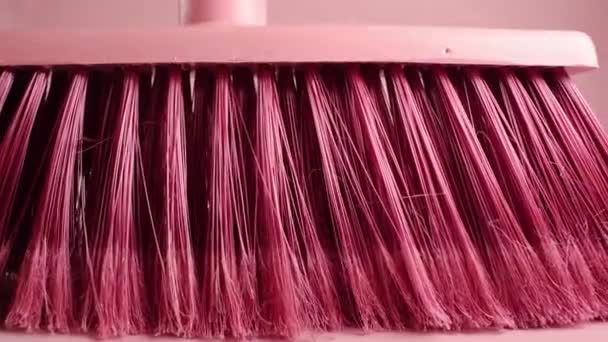 Close Pink Broom Moving Pink Background — Stockvideo