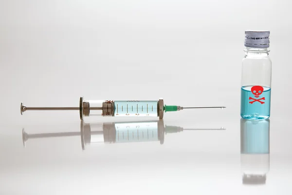 Syringe with needle and poison — Stock Photo, Image