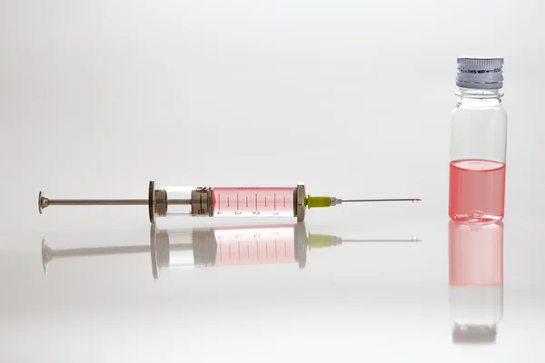 Syringe with needle and vial — Stock Photo, Image