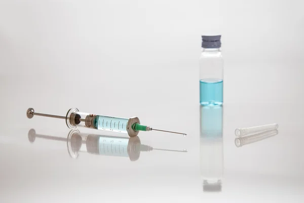 Syringe with needle and vial — Stock Photo, Image