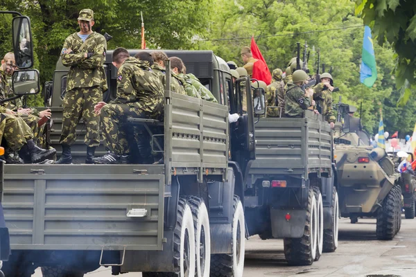 Column of military equipment on parade in honor of the 69th anni