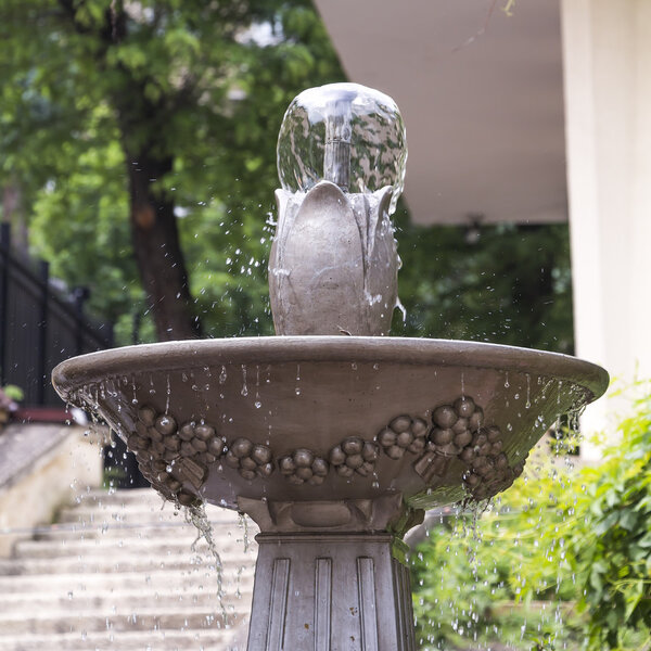 Outdoor stone fountain with a bowl