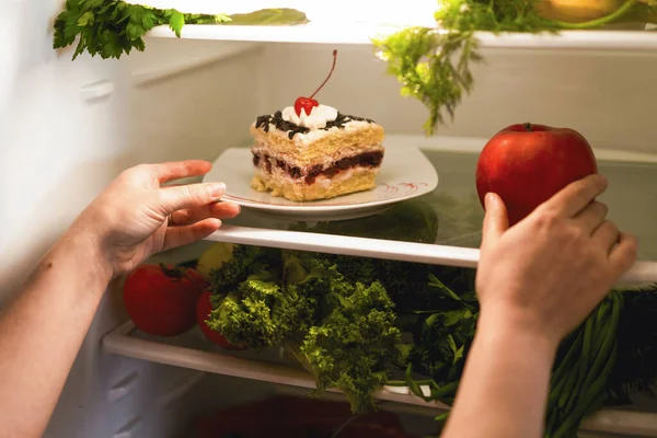 Choosing what to eat cake or apple. Food in the refrigerator. Adherence to a diet. Sugar in various products.