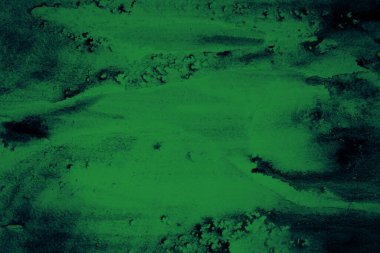 Soyut siyah mavi suluboya. Açık benekli koyu yeşil bir arka plan. Tasarım için sanatsal arkaplan.